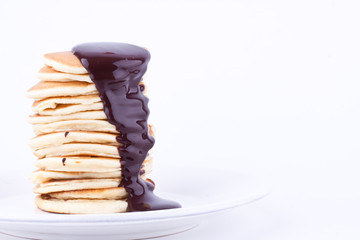 stack of pancakes with chocolate sauce