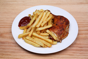 Fried fries and baked chicken leg
