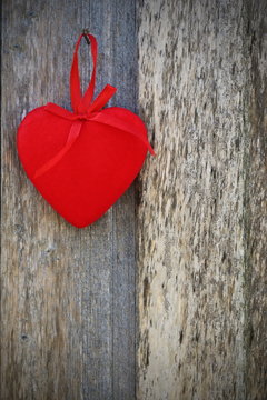 Red heart on the wooden background