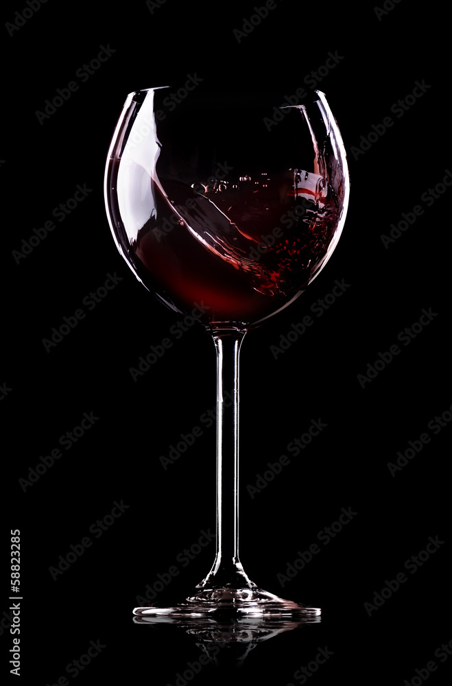 Wall mural wave of wine in wineglass