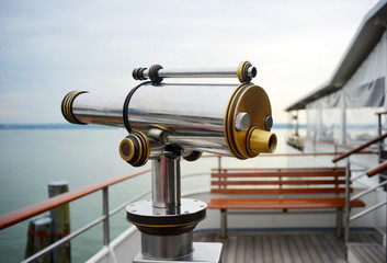 Binoculard on a steamboat maritime nautical travel symbol