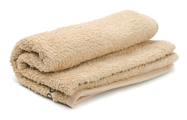 Fototapeta na wymiar Rolled beige bath terry towels