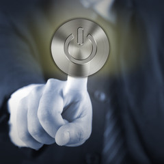 Hand touching power button