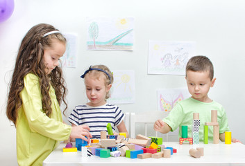 Children playing with blocks in kindergarten