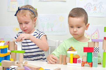 Children playing with blocks in kindergarten