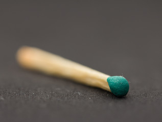 match on a black background. macro