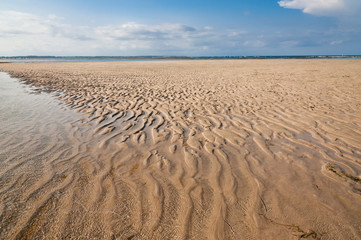 Fototapeta na wymiar Ocean and beach with yellow sand