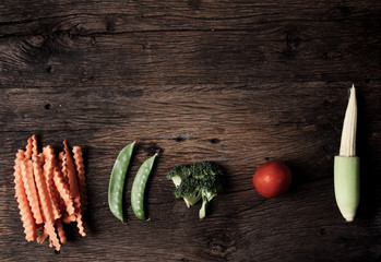 Still life with vegetables on wooden background