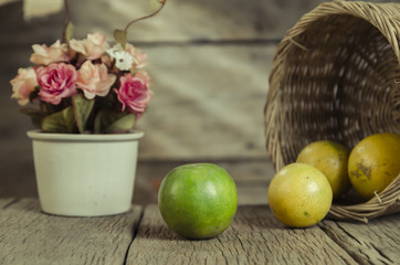 Green and yellow colour of the orange with basket