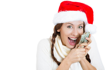 Excited christmas woman holding dollar bills, money