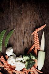 Still life with vegetables on wooden background