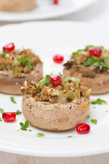 appetizer - stuffed mushrooms with herbs and pomegranate seeds