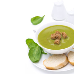 delicious spinach soup with croutons, close-up, isolated