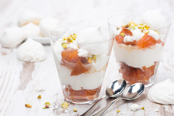 dessert with canned peaches, whipped cream and meringue