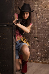 Girl sheriff shoots from a revolver