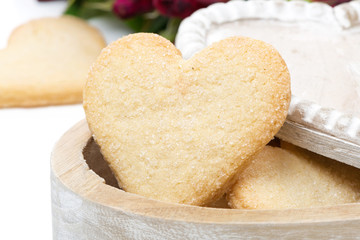 wooden box with cookies in the form of heart, close-up