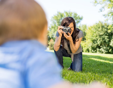 Woman Photographing Baby Son