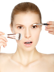 Beauty Girl with Makeup Brushes