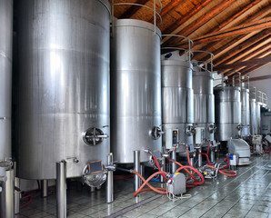 Stainless steel wine vats in a row