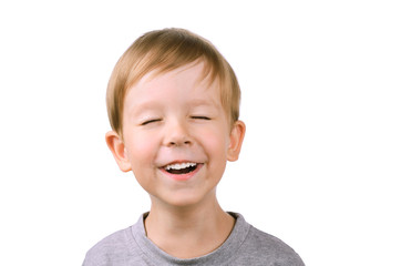 boy laughing with eyes closed