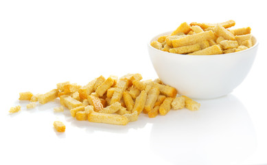 Croutons which have dropped out of a bowl