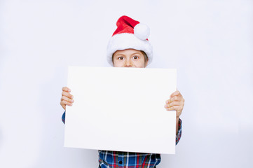 Fototapeta premium Kind mit Angebot zu Weihnachten