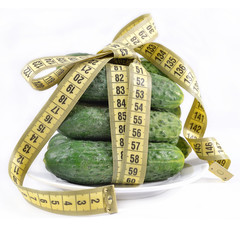 Cucumbers with yellow measuring tape