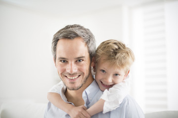 Father and his young son smiling