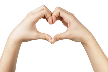 female teen hand makes heart shape with hands