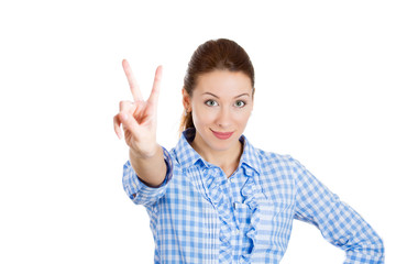 Excited young business woman giving victory sign