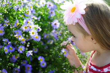 pretty little girl near colors