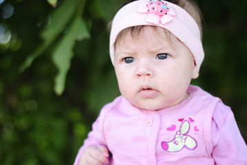 pretty little girl near colors