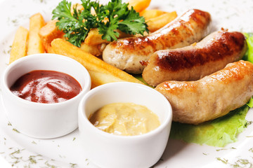 Tasty meat sausages with vegetables