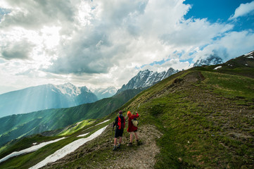 Fototapeta na wymiar Climbers on the path on mountain range.