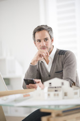 architect working at his laptop on the office