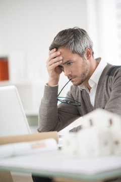 architect working at his laptop on the office