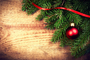 Vintage Christmas Background with Tree Branch on wooden backgrou