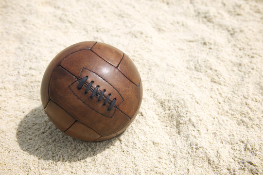 Vintage Brown Football Soccer Ball Sand Beach Background