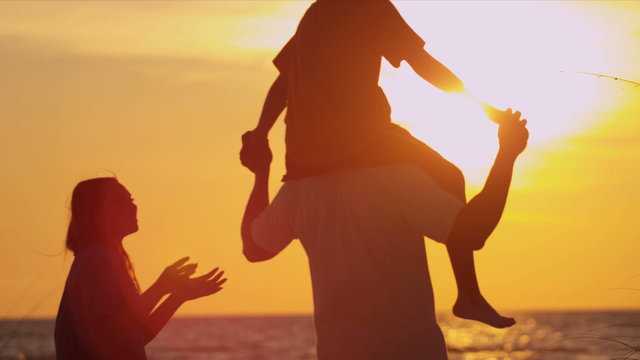 Ethnic Family Beach Vacation Sunset Silhouette
