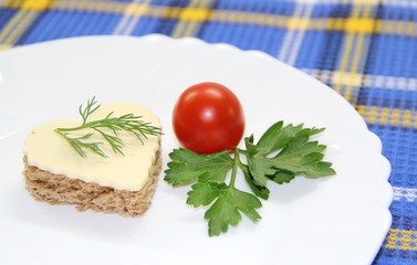 Small portion of food on a white plate