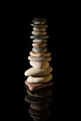 Stones balance isolated on black