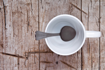 Fototapeta na wymiar empty white cup and spoon