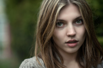 Fototapeta premium Close up of a beautiful girl face - outdoor