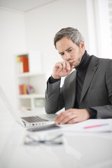 Fototapeta premium attractive man working in office