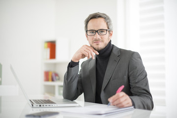 attractive man working in office