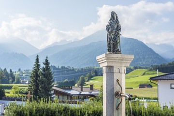 Obraz premium Fountain in Oberperfuss village, Austria.
