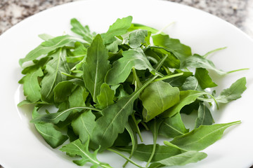 Plate with salad rocket leaves