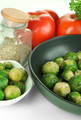 Fresh brussels sprouts in pan with vegetables and spices