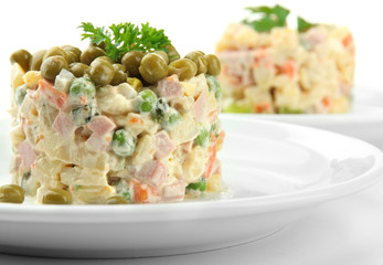 Russian traditional salad Olivier, isolated on white