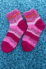 Woolen socks, on color background